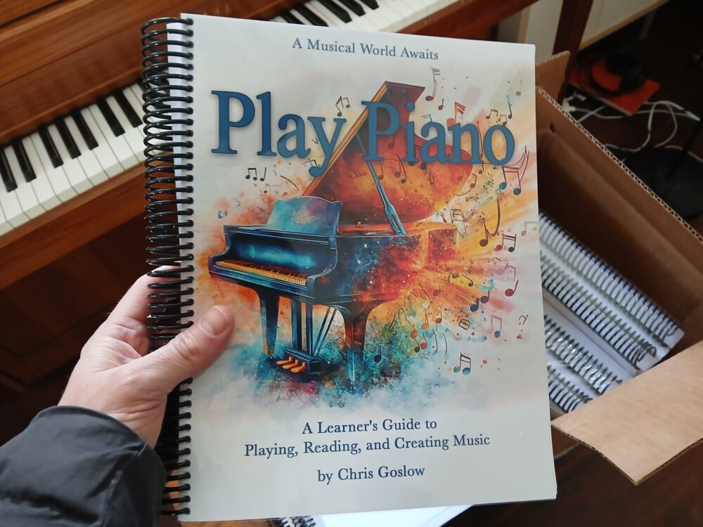 Play Piano book in hand (small)